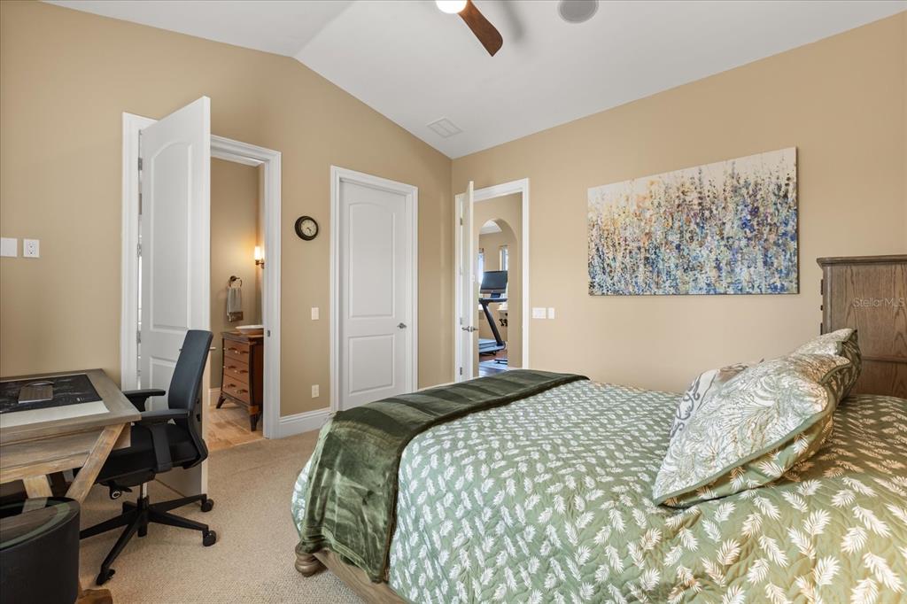 812 Stephens Pass Cove Lake Mary, FL 32746 - Photo 45 of 60 a bedroom with a bed and a desk