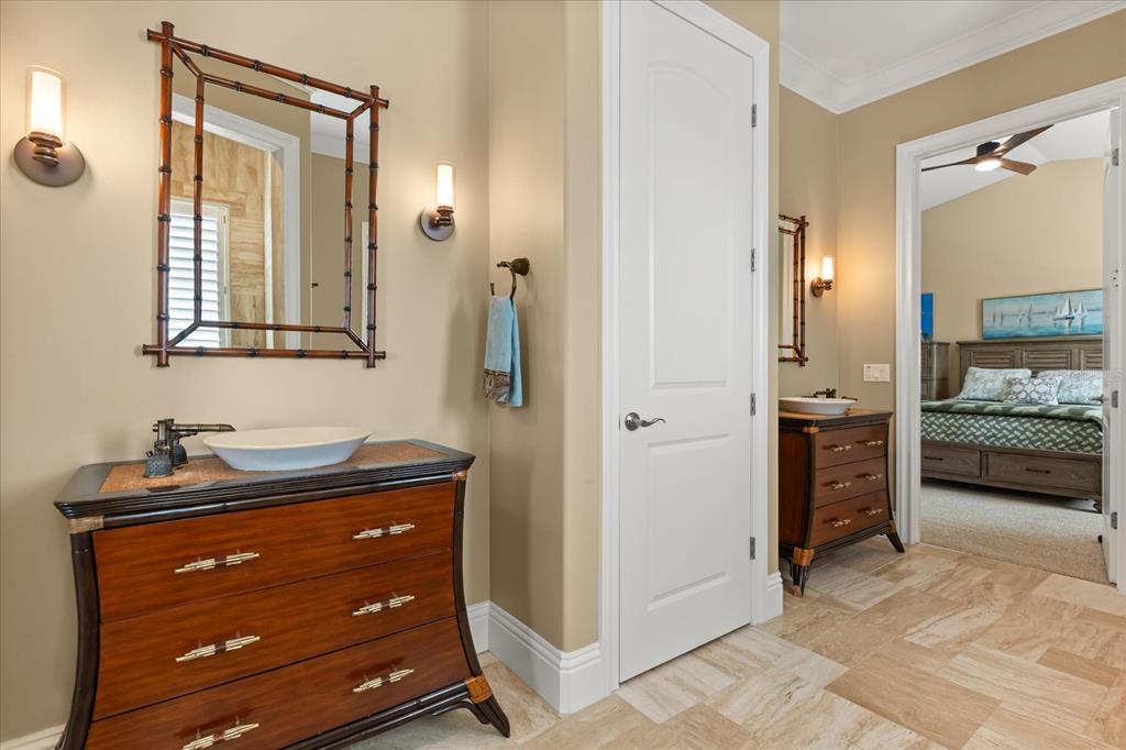 812 Stephens Pass Cove Lake Mary, FL 32746 - Photo 46 of 60 a bathroom with a sink and a mirror