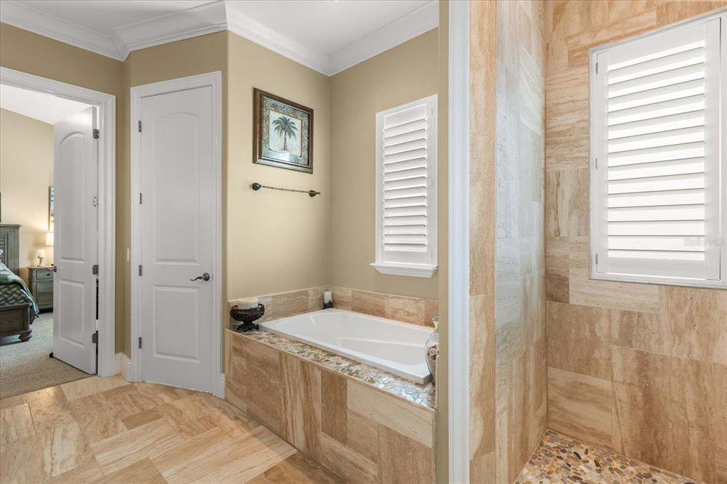 812 Stephens Pass Cove Lake Mary, FL 32746 - Photo 48 of 60 a bathroom with a tub sink and mirror