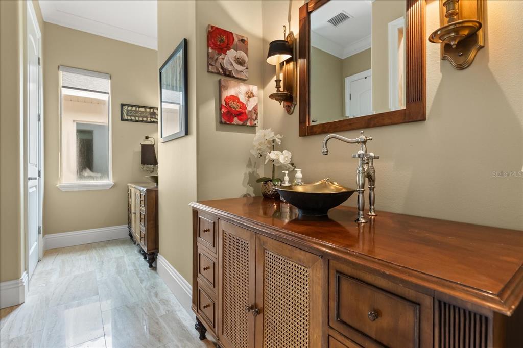 812 Stephens Pass Cove Lake Mary, FL 32746 - Photo 49 of 60 a bathroom with a sink and a mirror