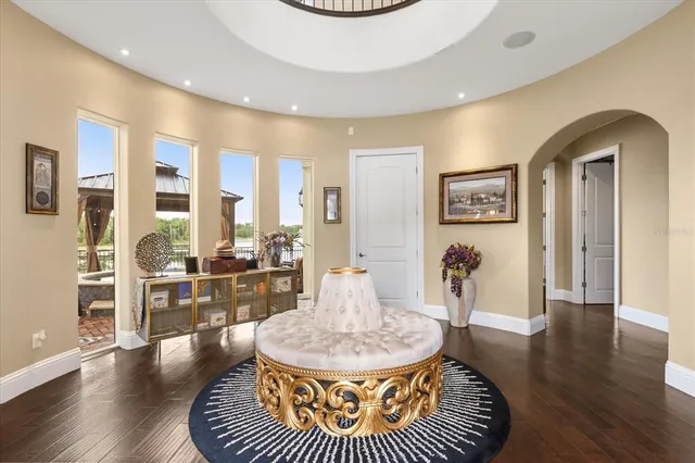 a living room with furniture and a chandelier
