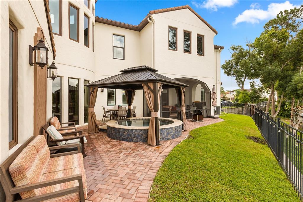 812 Stephens Pass Cove Lake Mary, FL 32746 - Photo 55 of 60 a view of a house with sitting area and garden