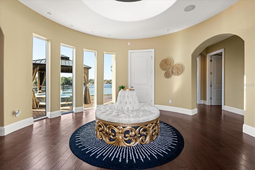 812 Stephens Pass Cove Lake Mary, FL 32746 - Photo 6 of 60 a view of a dining room with furniture wooden floor and a chandelier