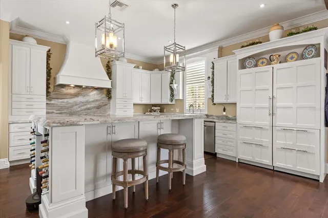 a kitchen with a stove a sink and a refrigerator