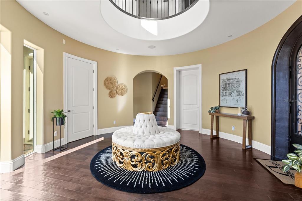 812 Stephens Pass Cove Lake Mary, FL 32746 - Photo 8 of 60 a living room with furniture and a chandelier