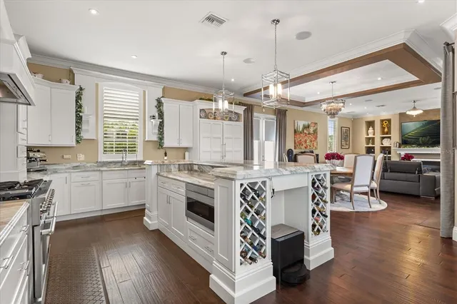 a kitchen with center island table and chairs in it