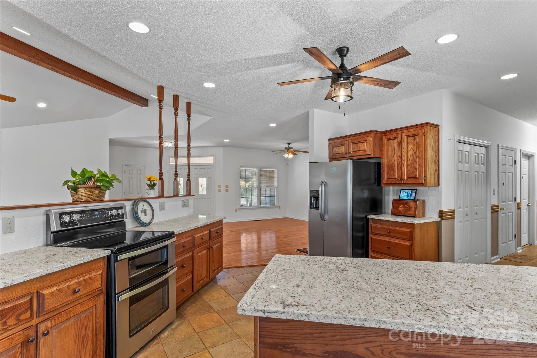 1030 Hurley School Road Salisbury, NC 28147 - Photo 13 of 48 a kitchen with stainless steel appliances granite countertop a sink a stove and a refrigerator