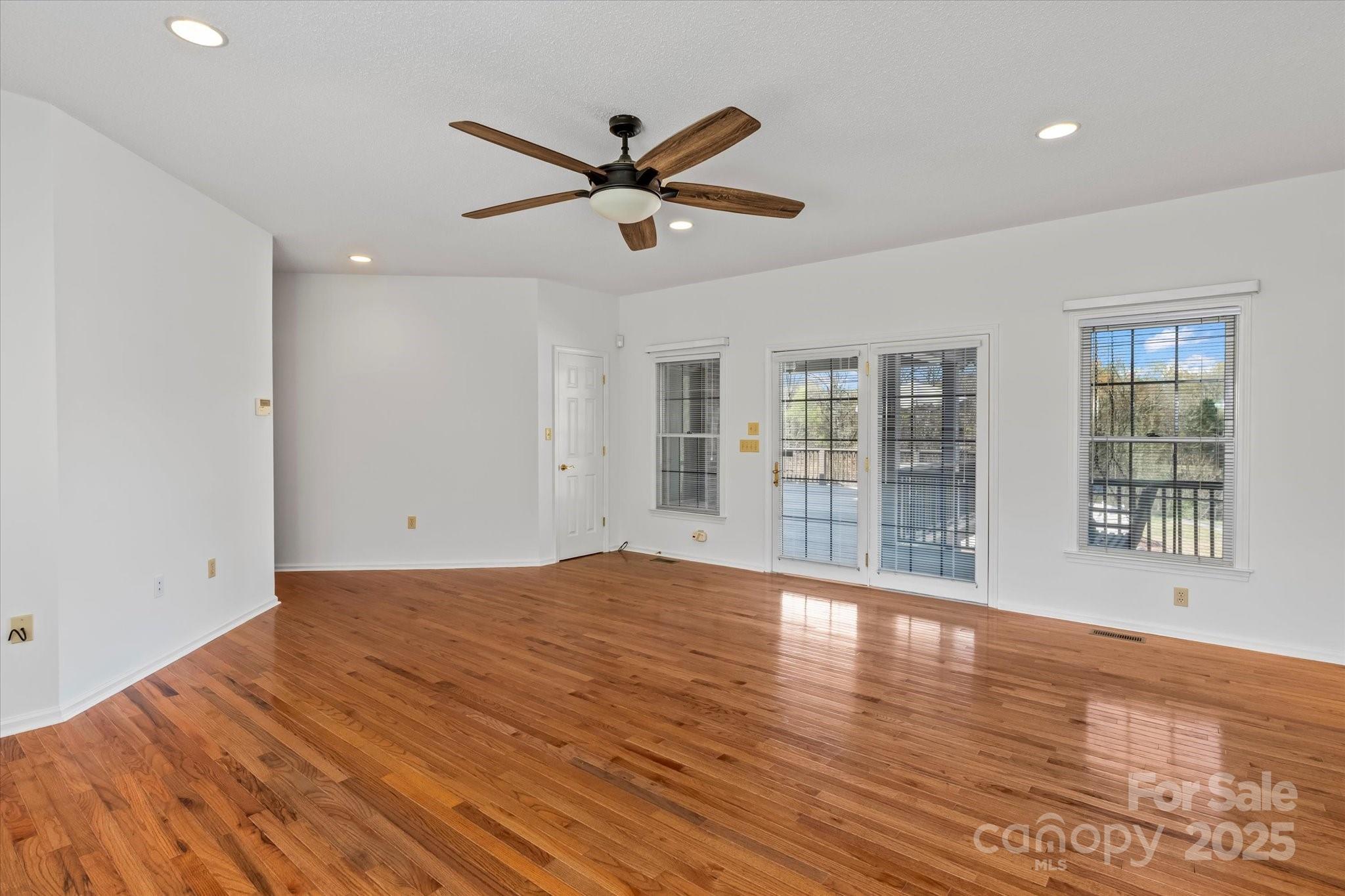 1030 Hurley School Road Salisbury, NC 28147 - Photo 15 of 48 a view of empty room with wooden floor and fan