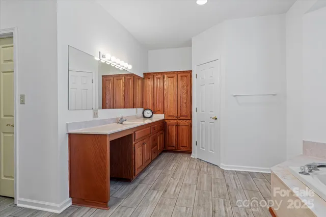 a room with a sink and a mirror