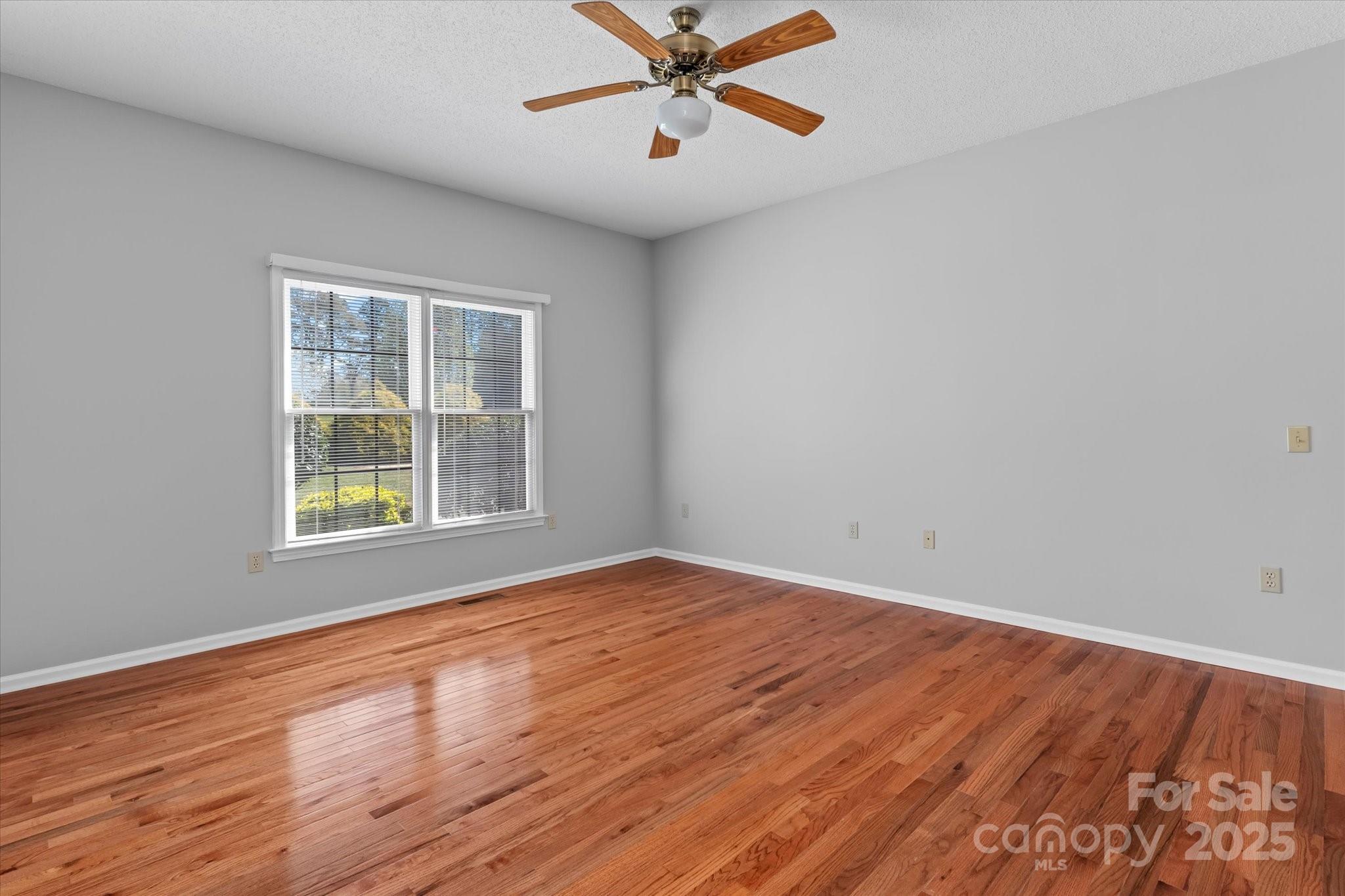 1030 Hurley School Road Salisbury, NC 28147 - Photo 21 of 48 wooden floor in an empty room with a window