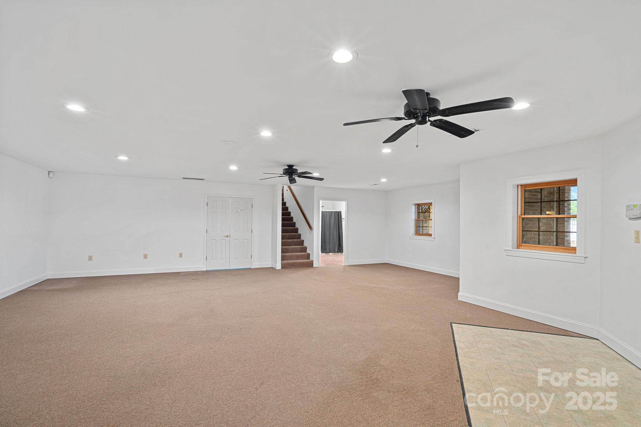 1030 Hurley School Road Salisbury, NC 28147 - Photo 29 of 48 a view of a livingroom with a ceiling fan and window