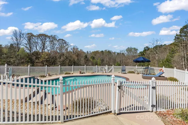a view of a wrought iron fences in front of house