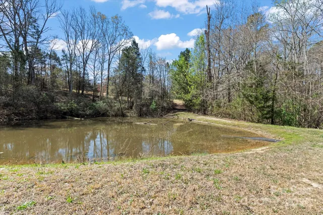a view of a house with roof deck and chair