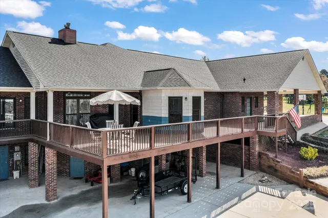 a view of a house with a snow in a backyard
