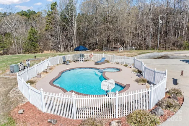 a view of a yard with snow on the road