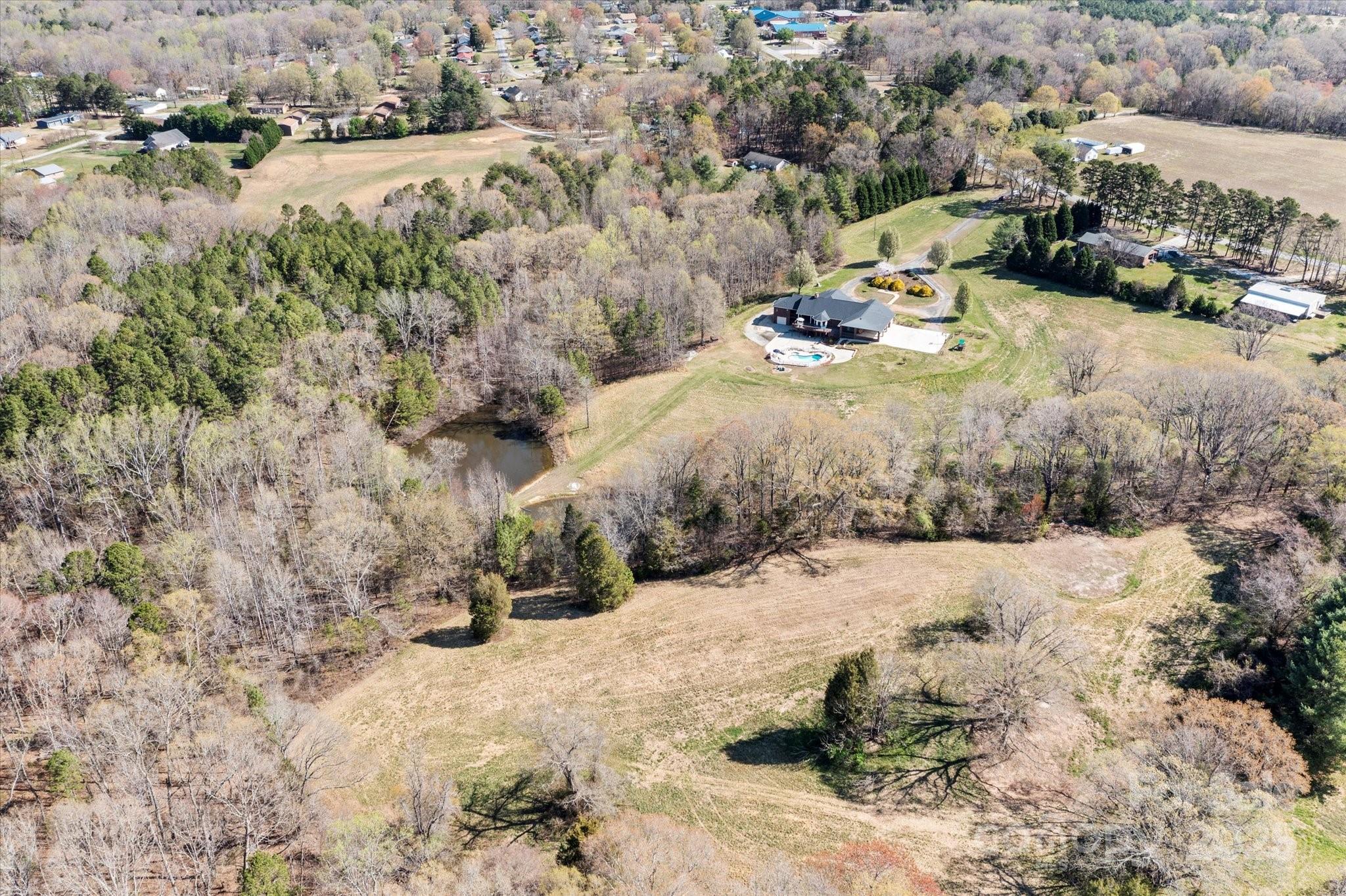 1030 Hurley School Road Salisbury, NC 28147 - Photo 43 of 48 a view of a yard with snow on the road