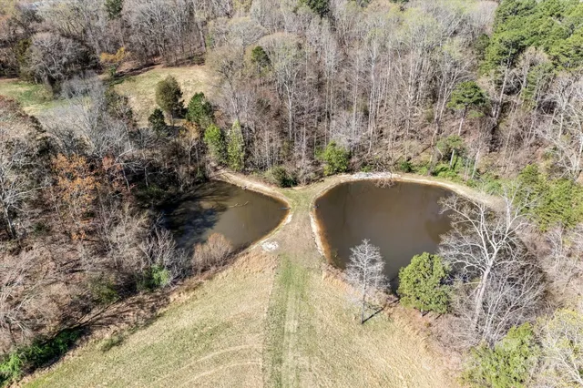 a view of a lake with a yard