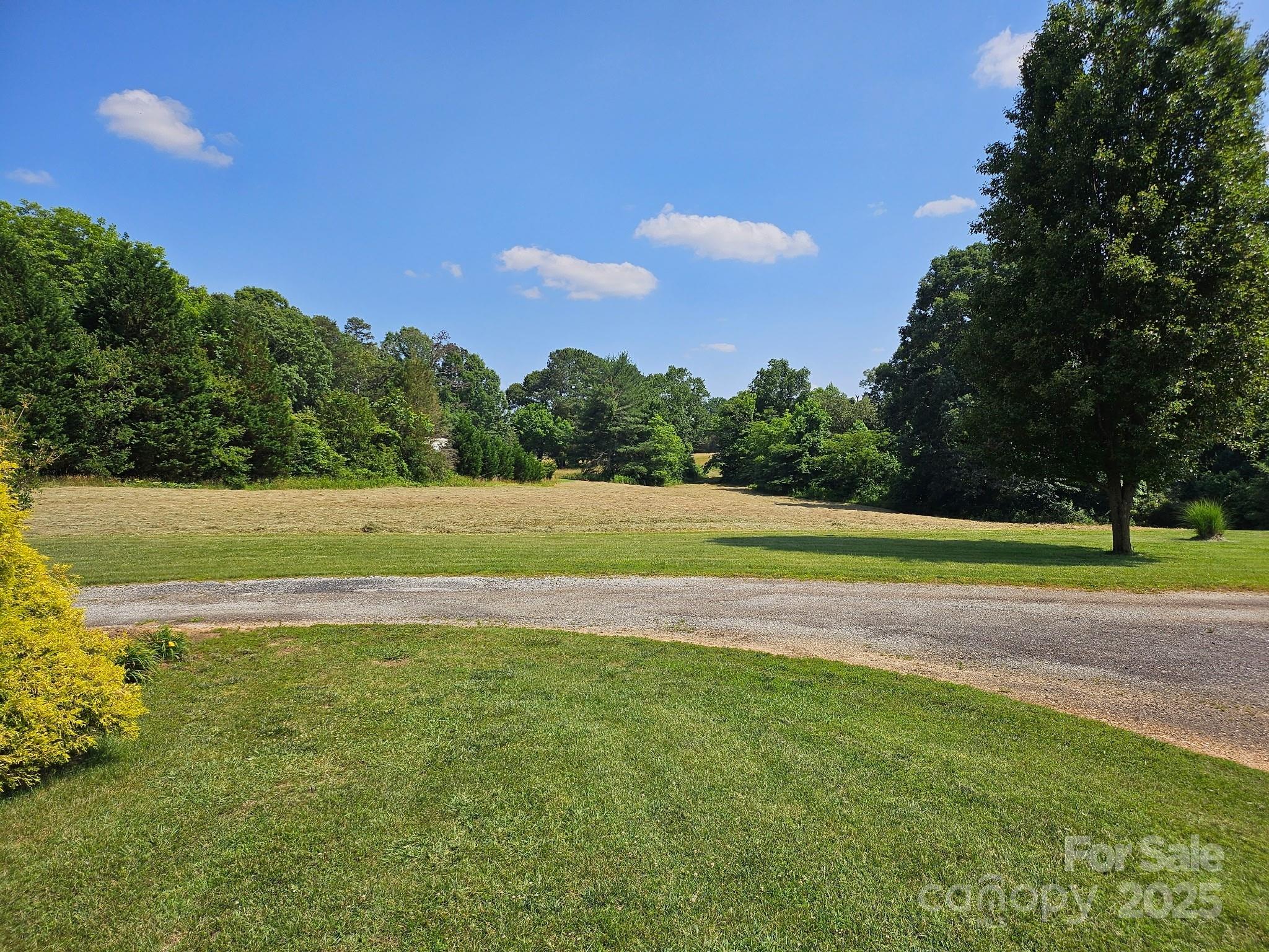 1030 Hurley School Road Salisbury, NC 28147 - Photo 46 of 48 a view of a golf course with a lake