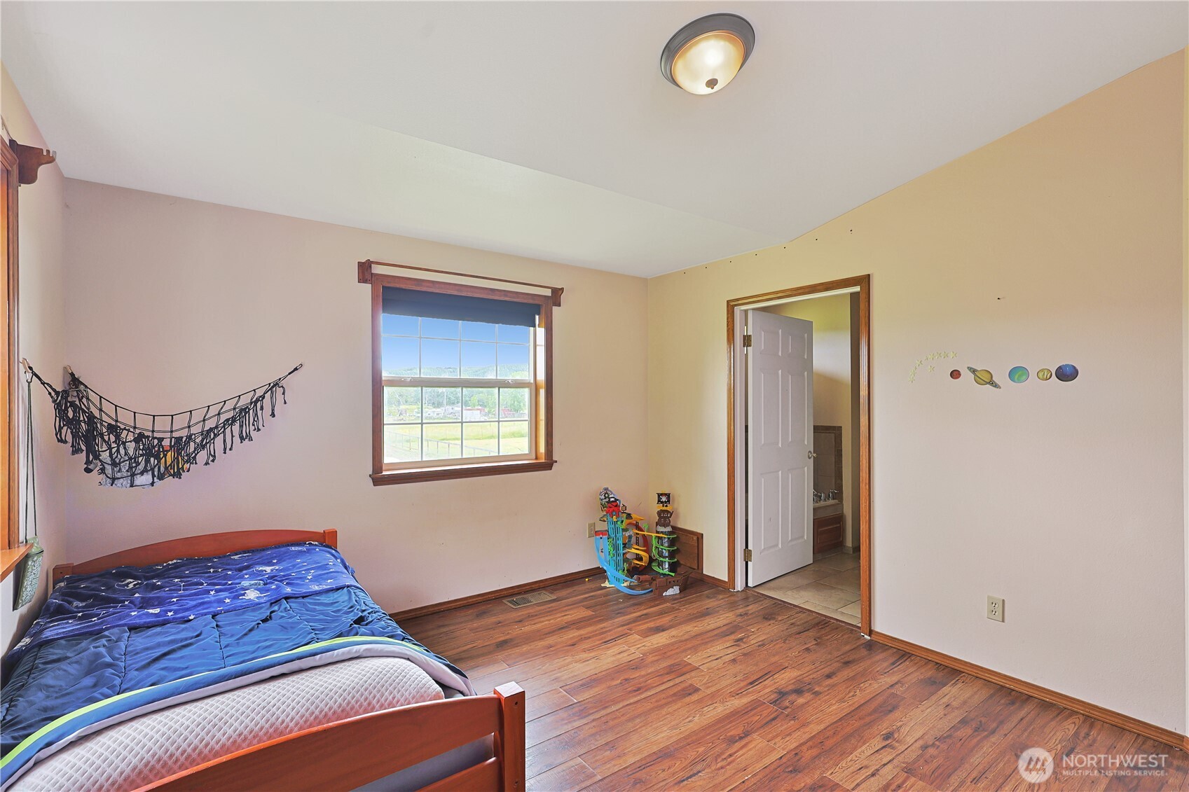 447 Boistfort Road Curtis, WA 98538 - Photo 16 of 40 a living room with a bed furniture and a window