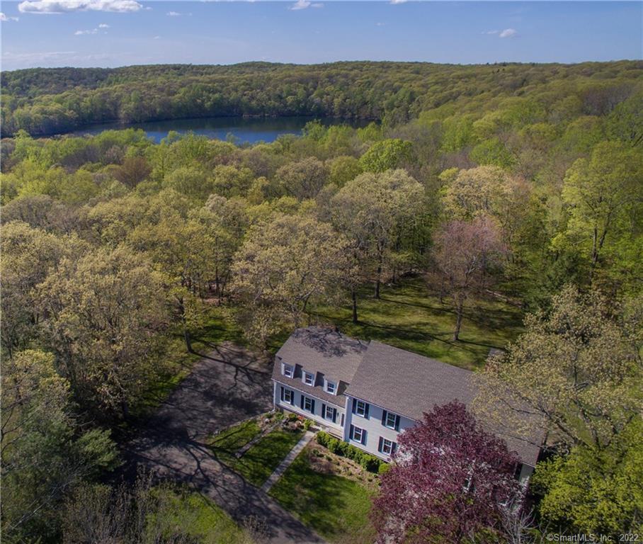 194 Old West Mountain Road Ridgefield, CT 06877 - Photo 1 of 1 a view of a lake with a mountain in the back