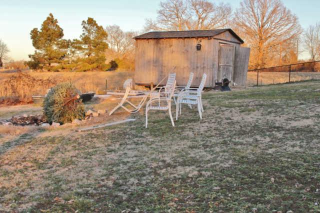 259 Martin Road Bon Aqua, TN 37025 - Photo 19 of 20 The fire pit area look over the dry creek that flows when it rains and the field/pasture. Shed also conveys and has electric ran but is not working at this time.