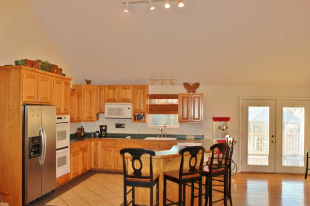 259 Martin Road Bon Aqua, TN 37025 - Photo 5 of 20 Kitchen is large and roomey. All appliances convey. The French doors exit onto the large deck that expands the entire back of the home, which overlooks the family pool.
