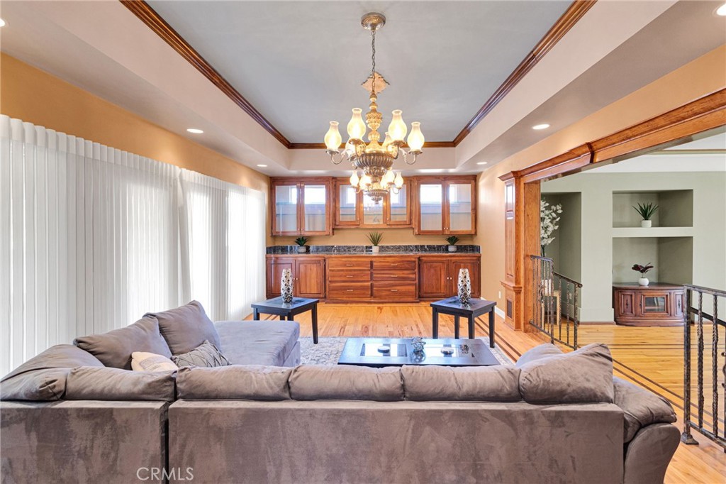 15023 Genesee Road Apple Valley, CA 92307 - Photo 12 of 61 a living room with furniture a chandelier and a large window