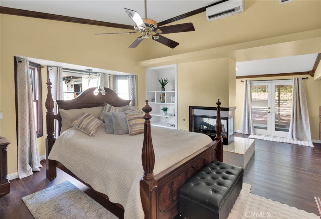 15023 Genesee Road Apple Valley, CA 92307 - Photo 15 of 61 a bedroom with a bed and wooden floor