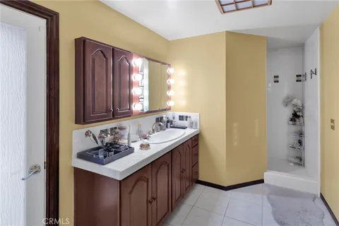 a bedroom with a bed window and walk in closet