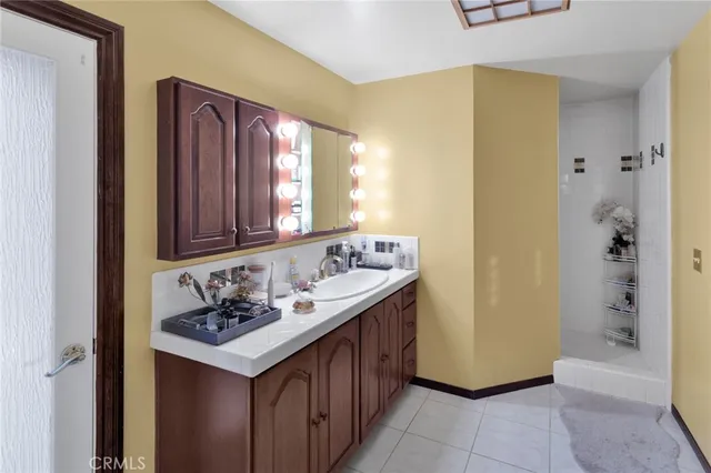 a bedroom with a bed window and walk in closet