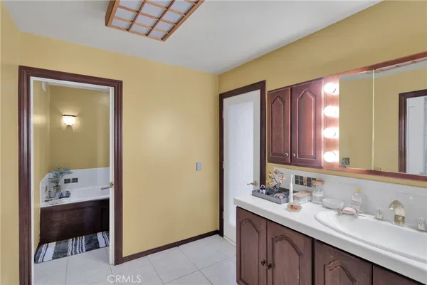 a bedroom with a bed and dresser