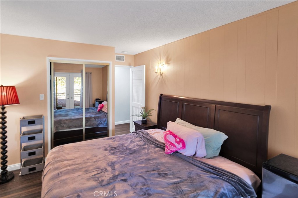 15023 Genesee Road Apple Valley, CA 92307 - Photo 24 of 61 a bedroom with a bed and dresser