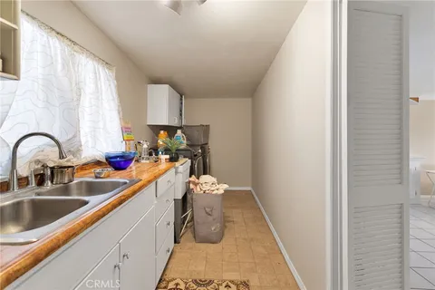 a living room with a bed furniture and a window