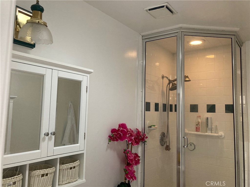 15023 Genesee Road Apple Valley, CA 92307 - Photo 31 of 61 a bathroom with a shower