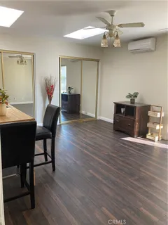 a view of an empty room with a fireplace and a window
