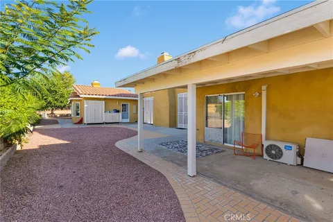a front view of a house with a outdoor space