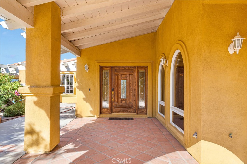 15023 Genesee Road Apple Valley, CA 92307 - Photo 55 of 61 a front view of a house with a outdoor space