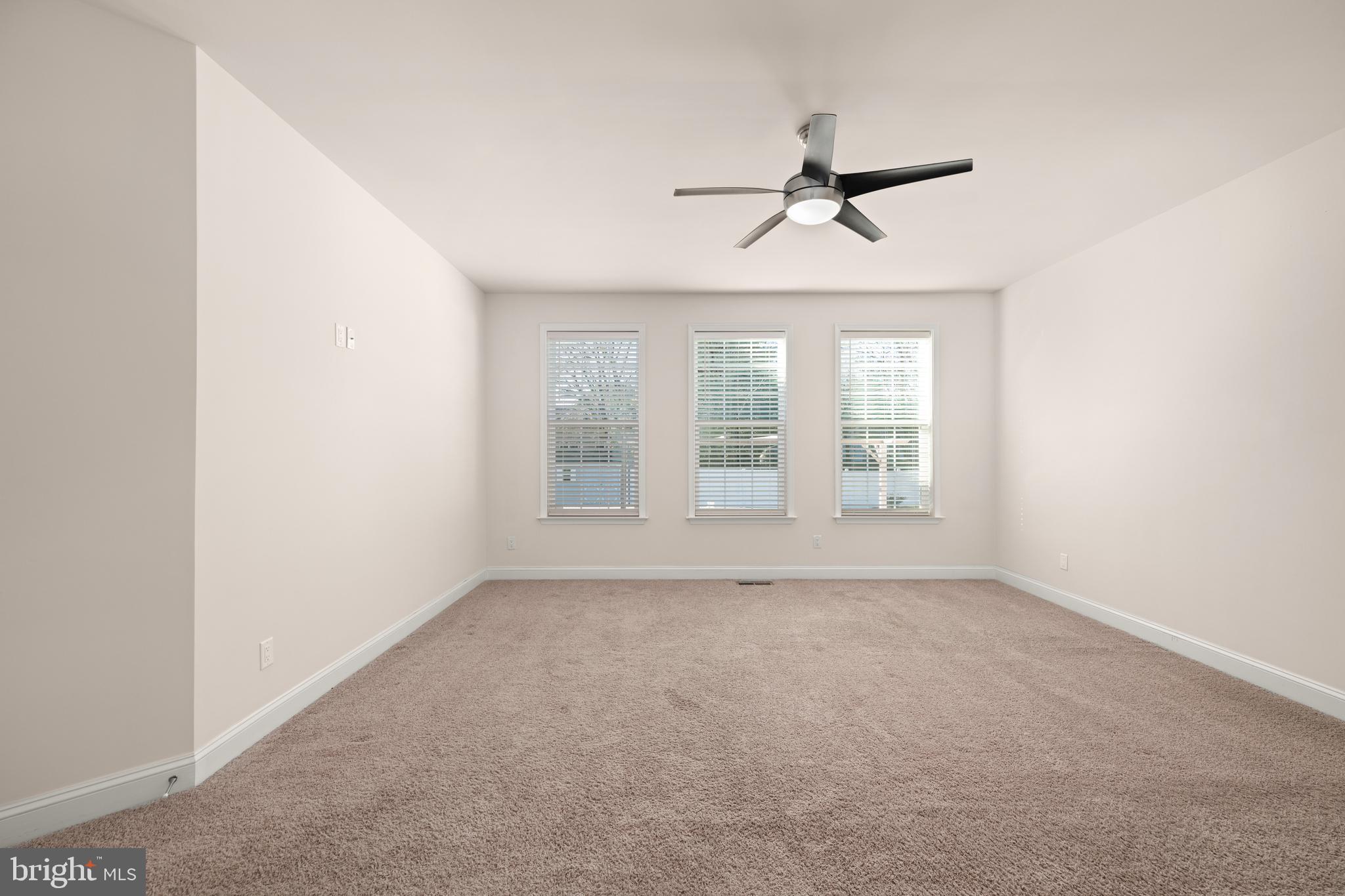 33057 Short Road Lewes, DE 19958 - Photo 10 of 40 an empty room with windows and fan