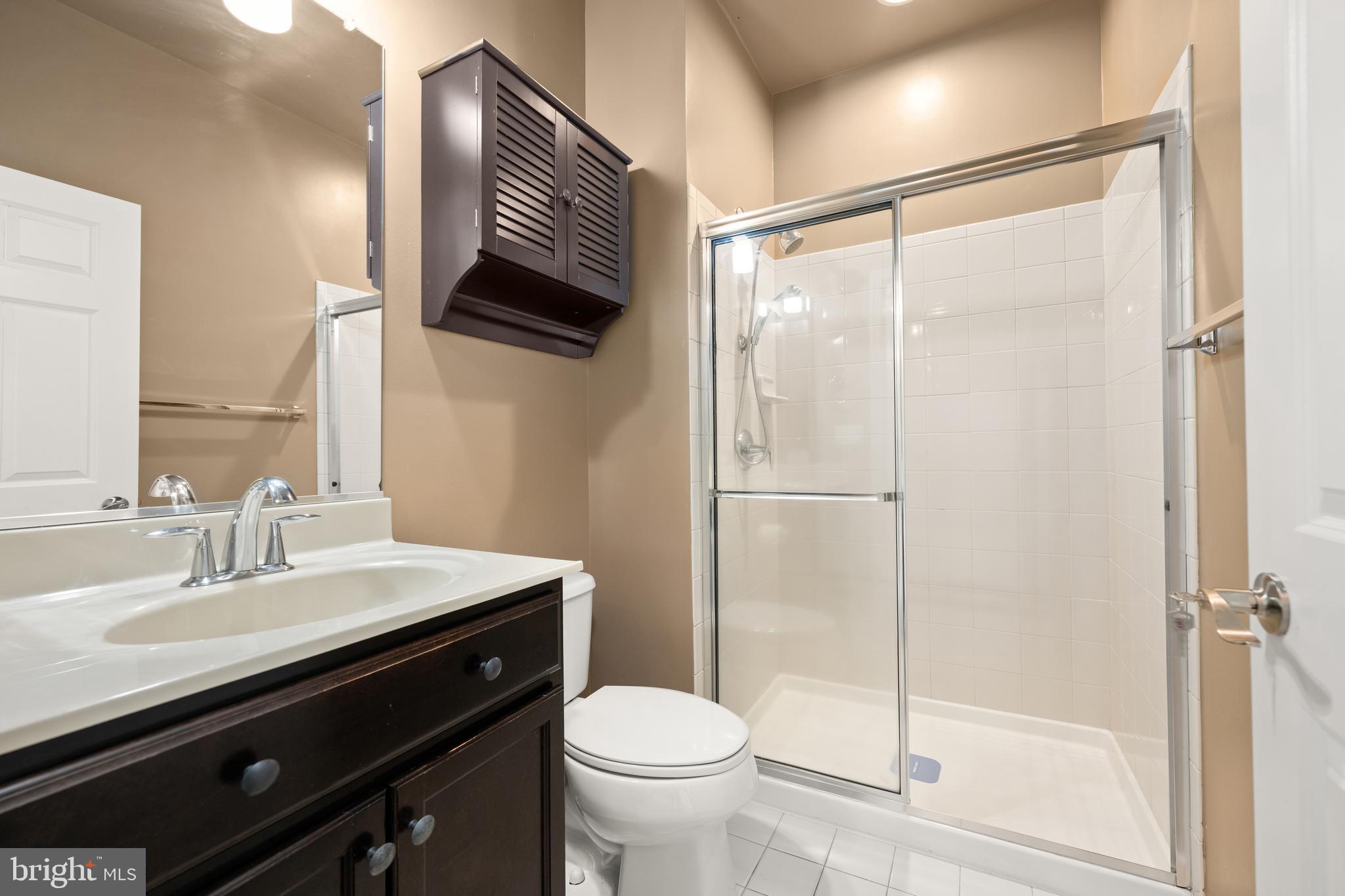 33057 Short Road Lewes, DE 19958 - Photo 17 of 40 a bathroom with a sink toilet and shower