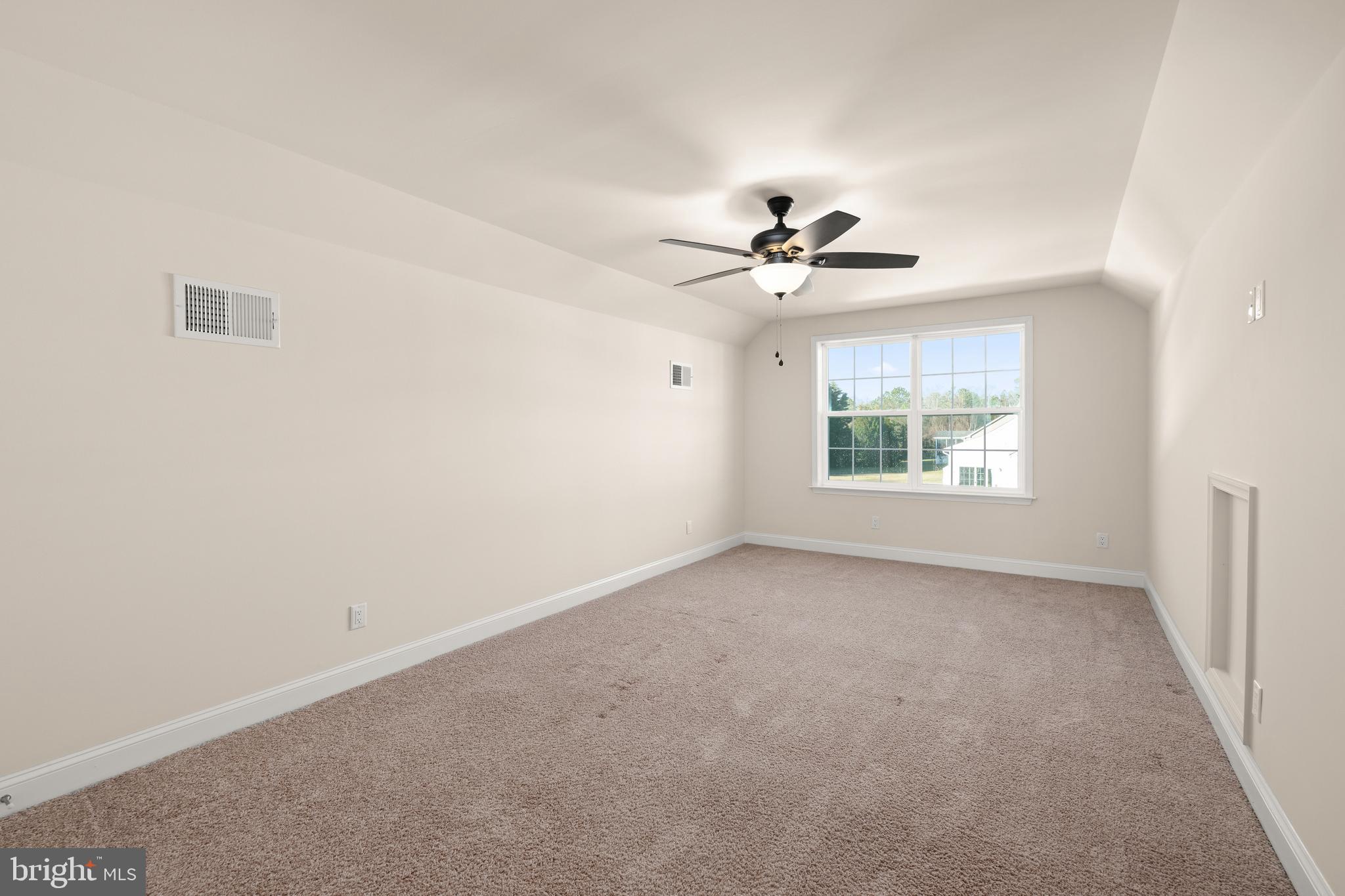 33057 Short Road Lewes, DE 19958 - Photo 22 of 40 an empty room with windows and chandelier fan