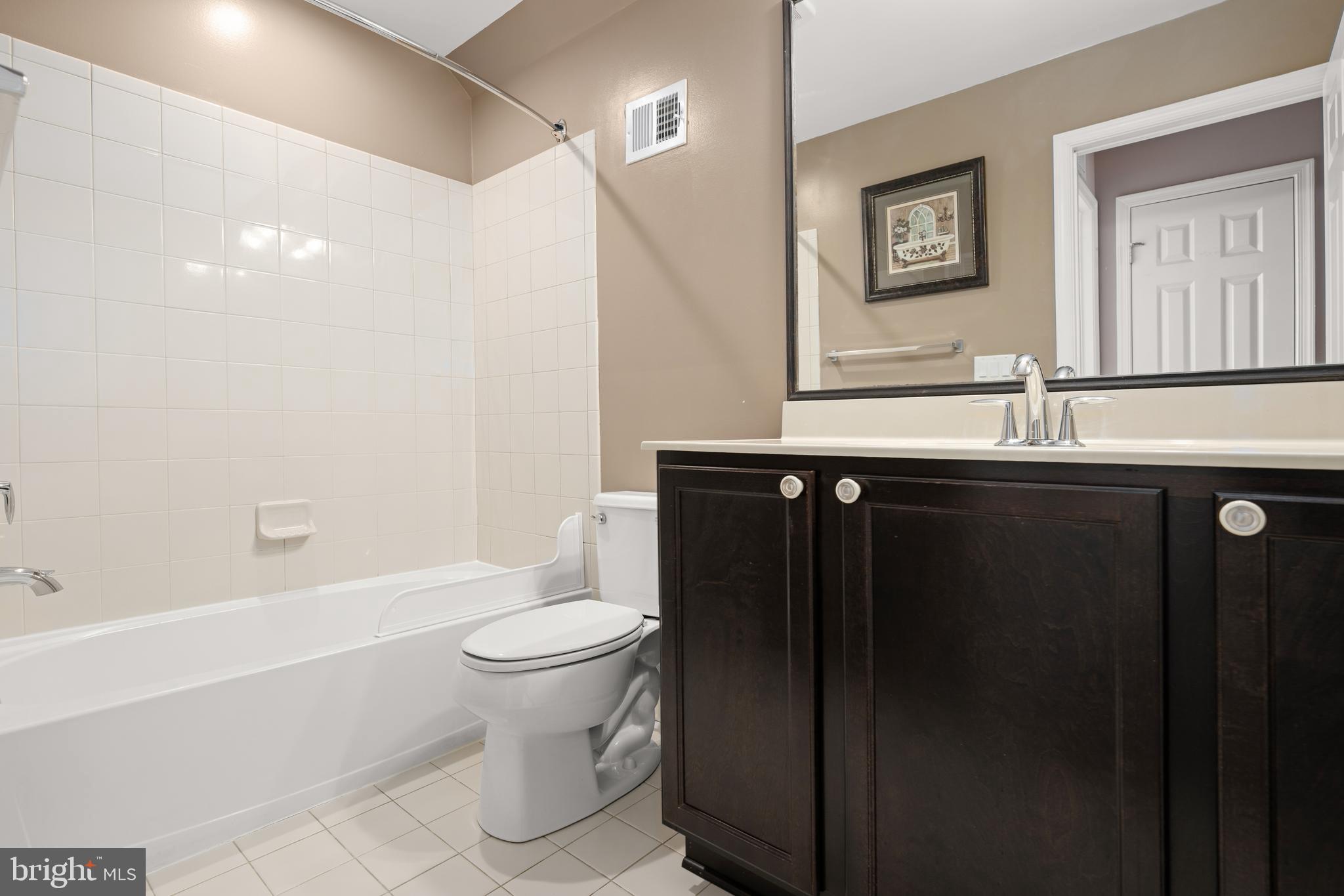 33057 Short Road Lewes, DE 19958 - Photo 24 of 40 a bathroom with a sink a toilet and shower