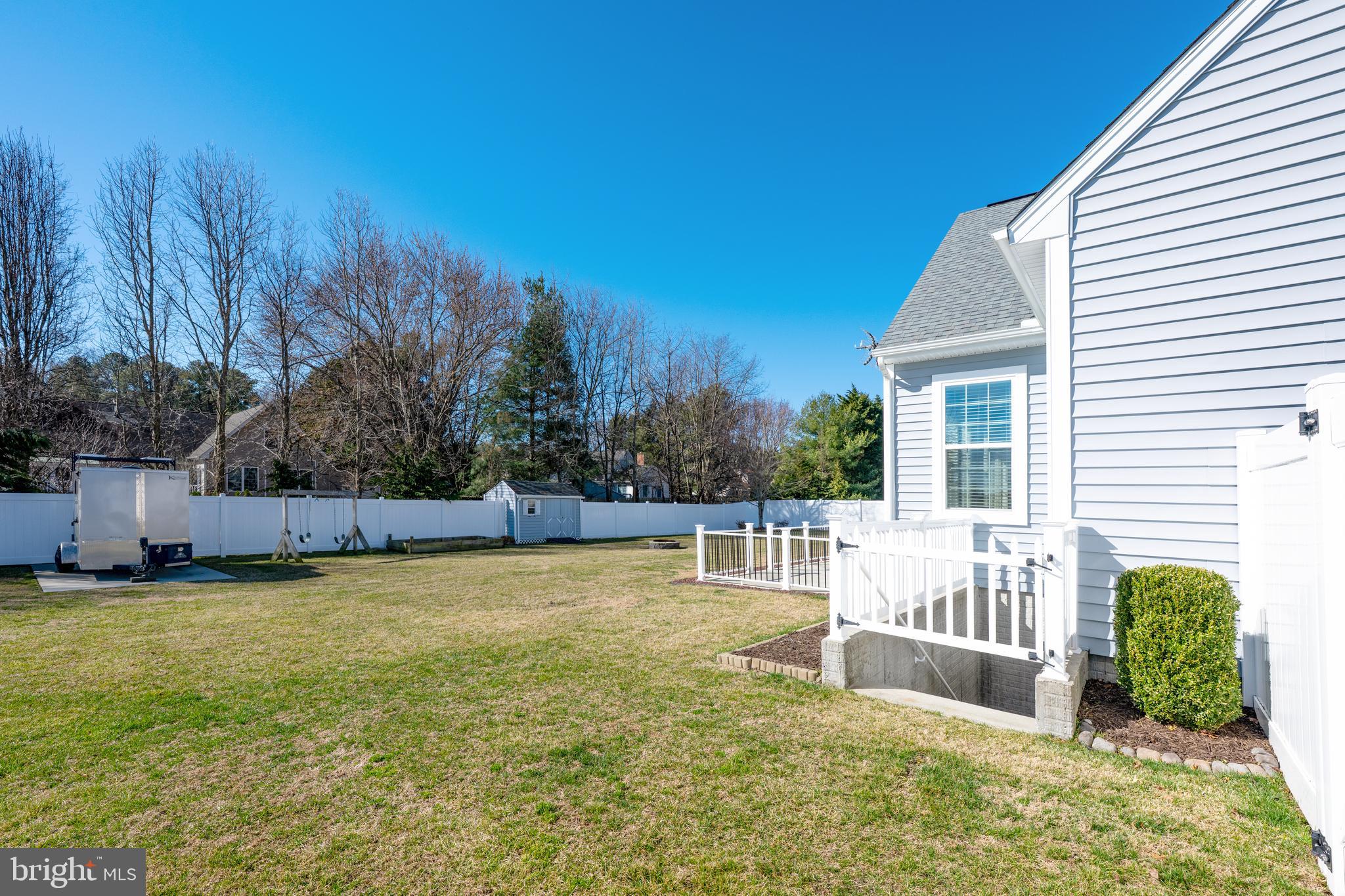 33057 Short Road Lewes, DE 19958 - Photo 35 of 40 a view of a house with backyard and sitting area
