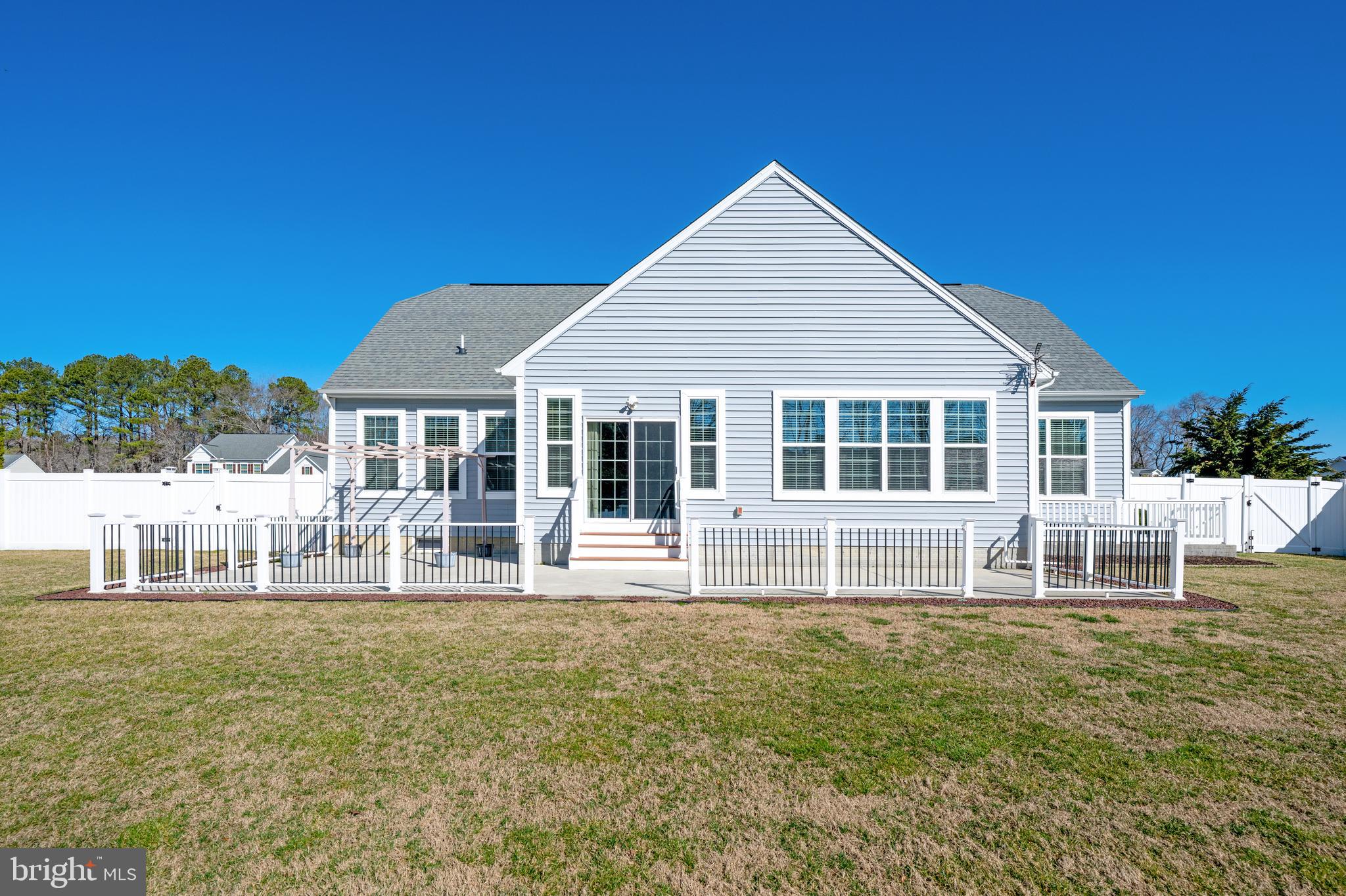 33057 Short Road Lewes, DE 19958 - Photo 38 of 40 a front view of a house with a yard table and chairs
