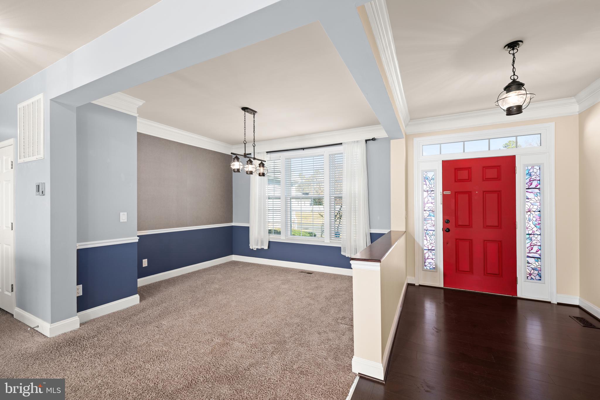 33057 Short Road Lewes, DE 19958 - Photo 9 of 40 a view of an empty room with window and wooden floor