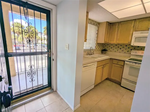 a view of a kitchen with appliances and cabinets