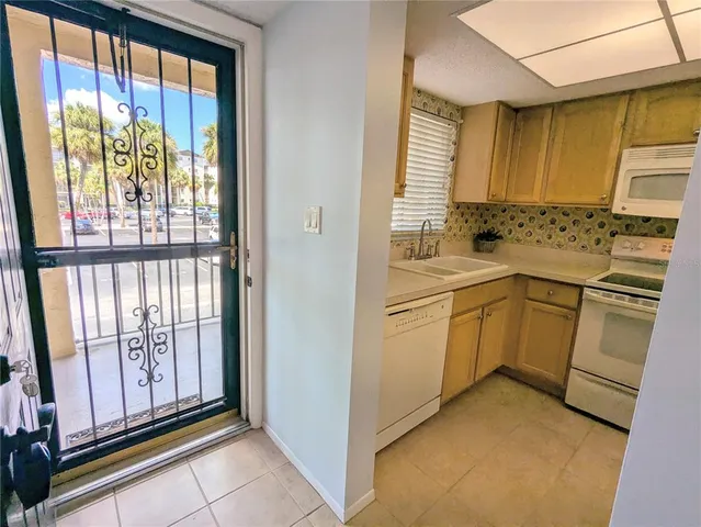 a view of a kitchen with appliances and cabinets