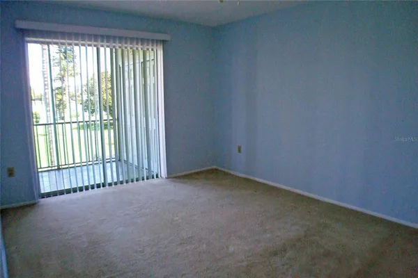 wooden floor and closet area in a room