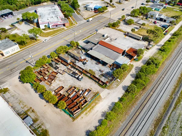 an aerial view of houses with outdoor space