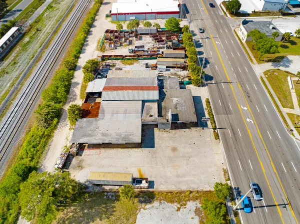 an aerial view of a residential apartment building with a yard