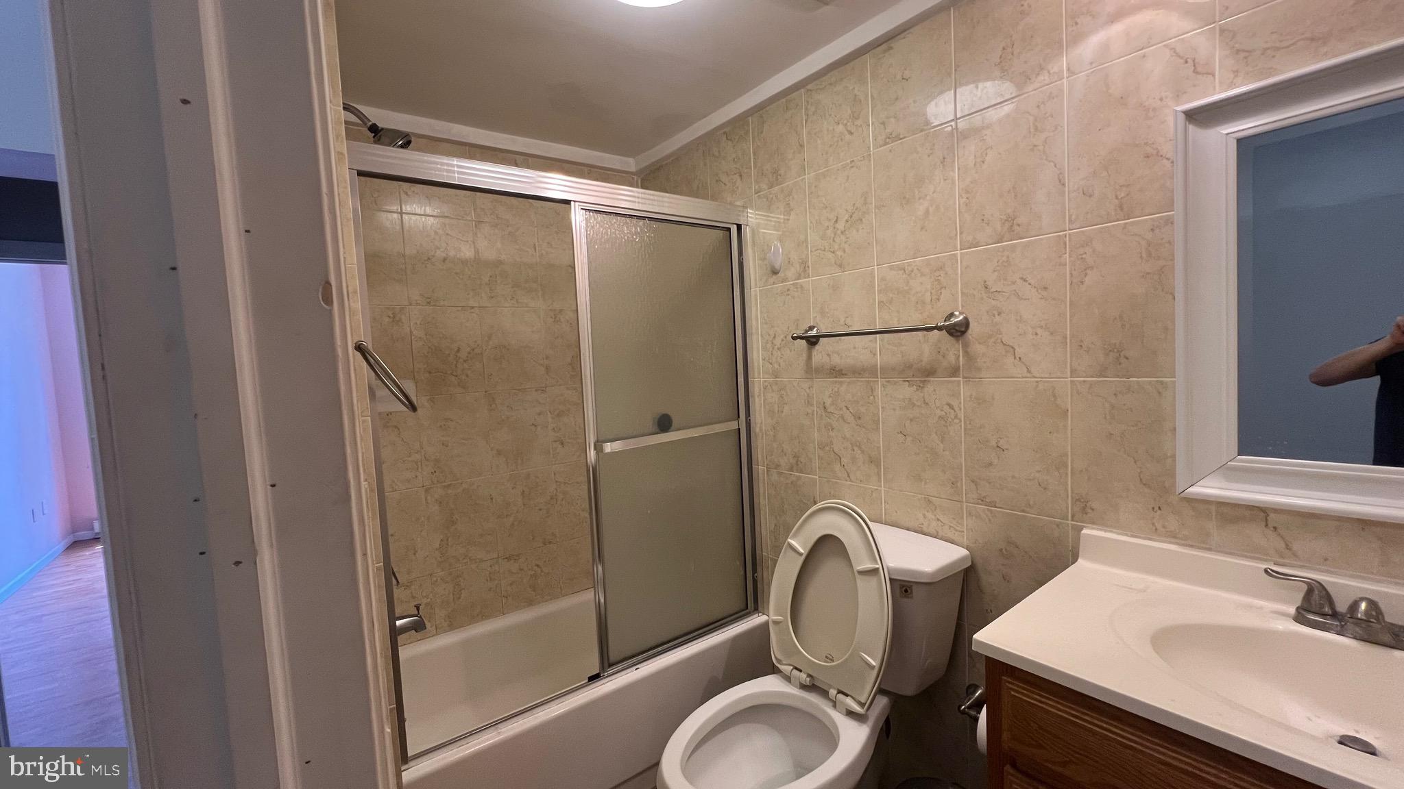 1115 Walnut Street, Unit 2F Philadelphia, PA 19107 - Photo 10 of 14 a bathroom with a sink toilet and shower